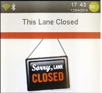 Ingenico terminal showing This Lane Closed standby screen